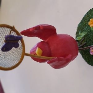 Pink bird with butterfly